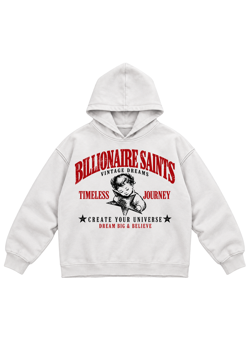 A white pullover hoodie featuring a vintage-style graphic print on the front. The design includes the words 'BILLIONAIRE SAINTS' in large red letters, 'VINTAGE DREAMS' underneath, a black-and-white illustration of a man holding a briefcase, 'TIMELESS JOURNEY' in red, and 'CREATE YOUR UNIVERSE DREAM BIG & BELIEVE' with black stars at the bottom.